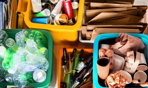 glass-bottles-in-a-basket-with-other-recycling-materials.jpg